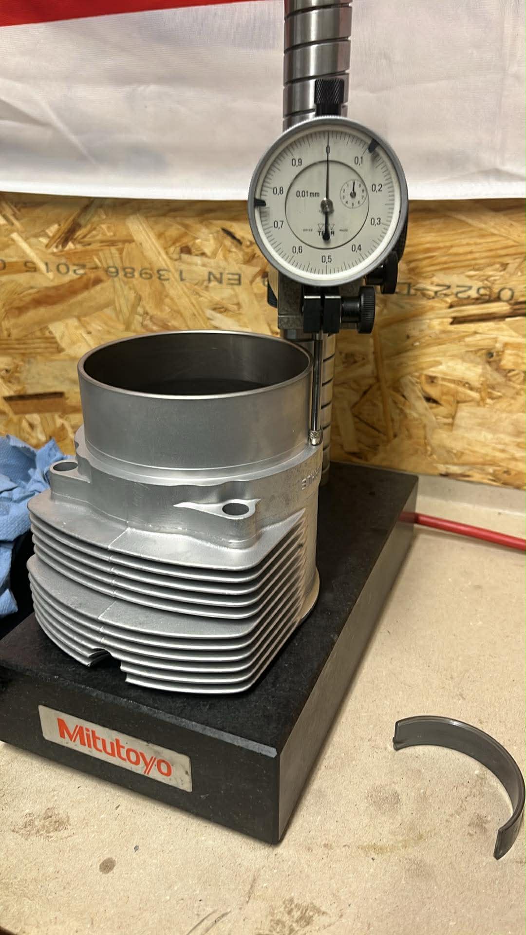Cylinder measured with a dial gauge on a granite surface plate