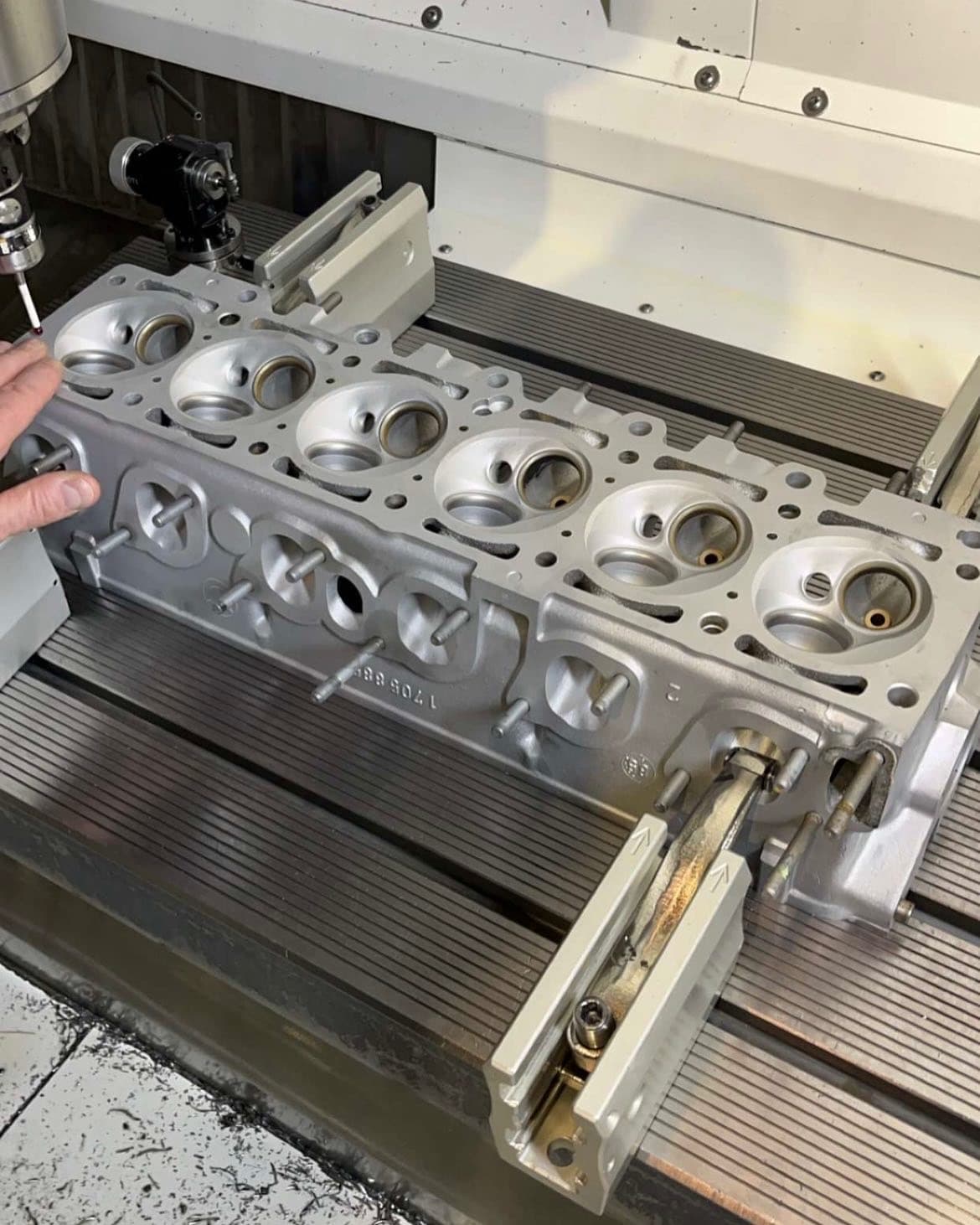 Cylinder head clamped on the machine table after resurfacing